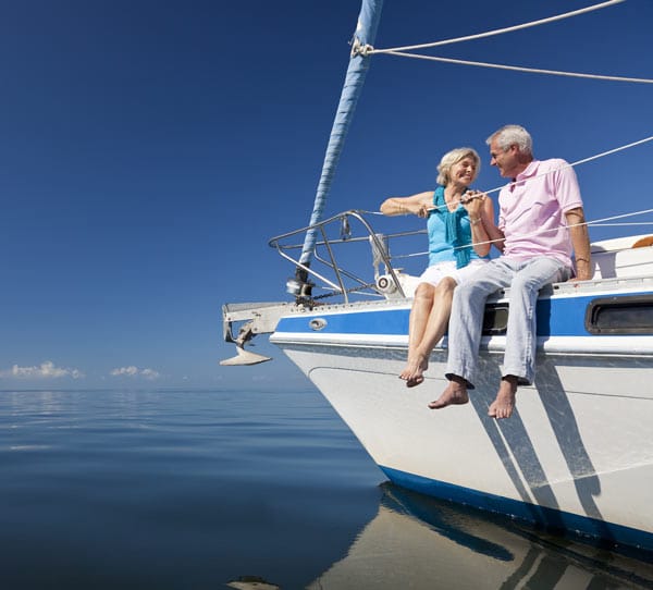 couple enjoying their yacht after pensions advice in cambridge 